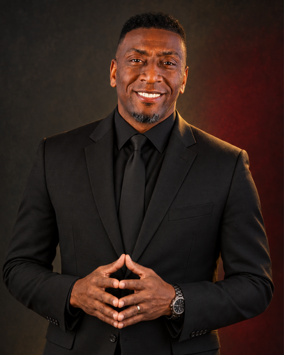 Dr. C. Maurice Ball wearing a black suit